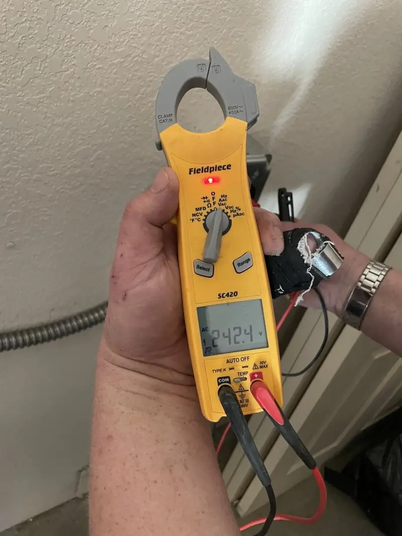 Voltage testing with clamp meter during Recessed Lighting Installation in Newstead